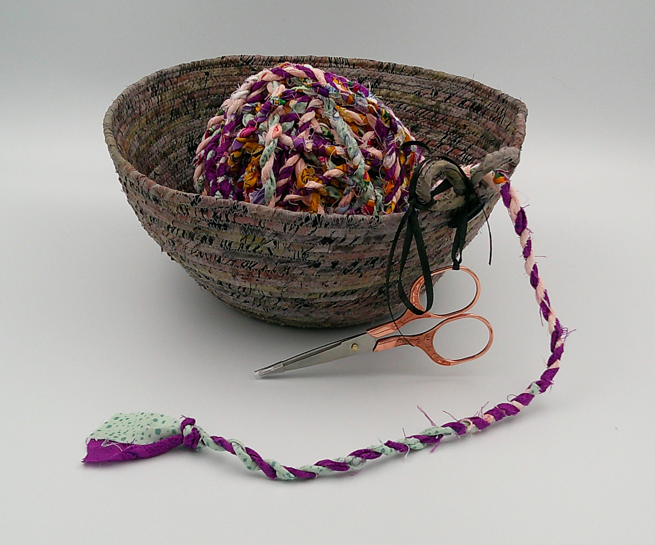 This shows the scissors hanging on the outside but still attached with ribbon. Sitting on the inside is a 35-yard ball of my fabric rope. This shows the scissors hanging on the outside but still attached with ribbon. Sitting on the inside is a 35-yard ball of my fabric rope.
